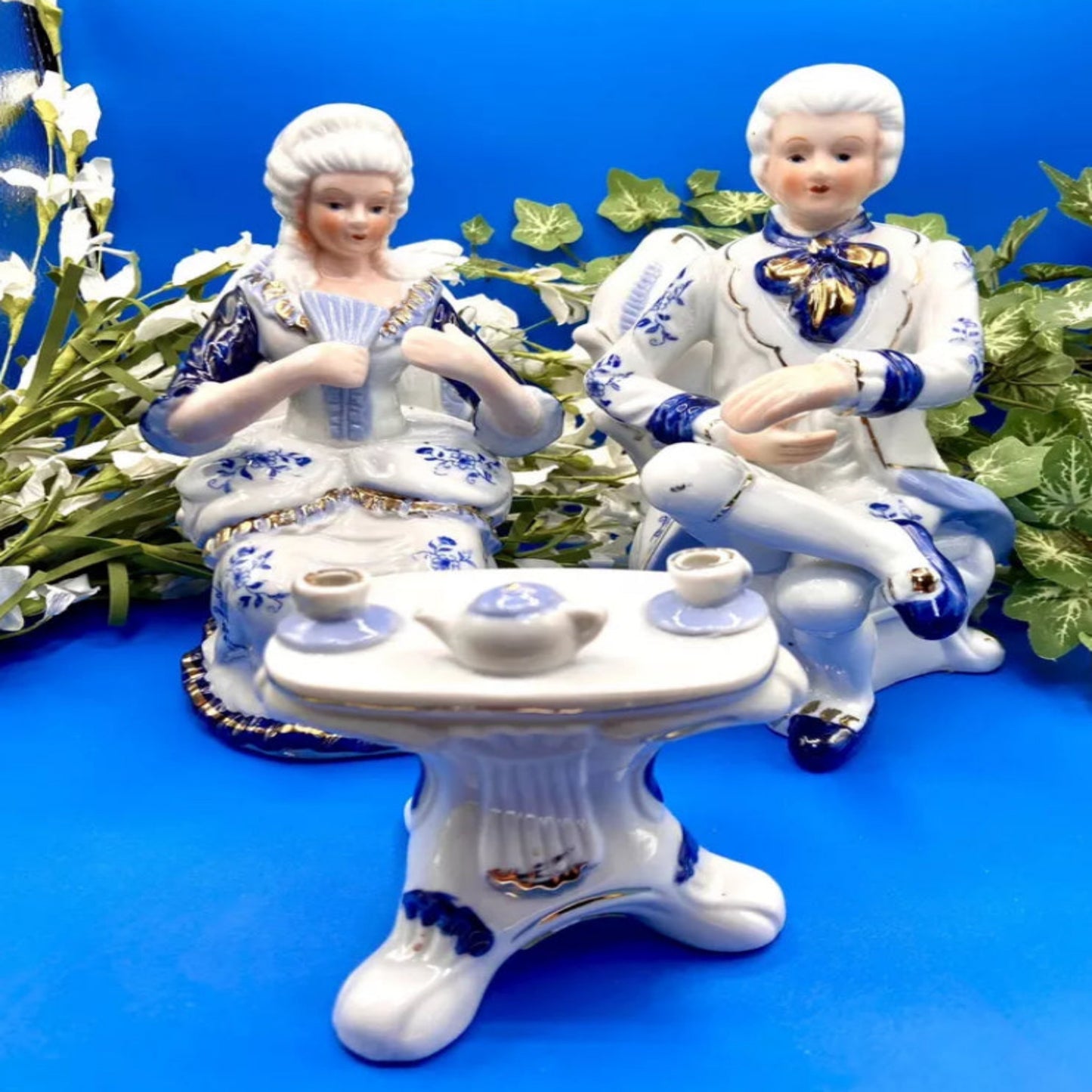 deville colonial figurines sitting tea party