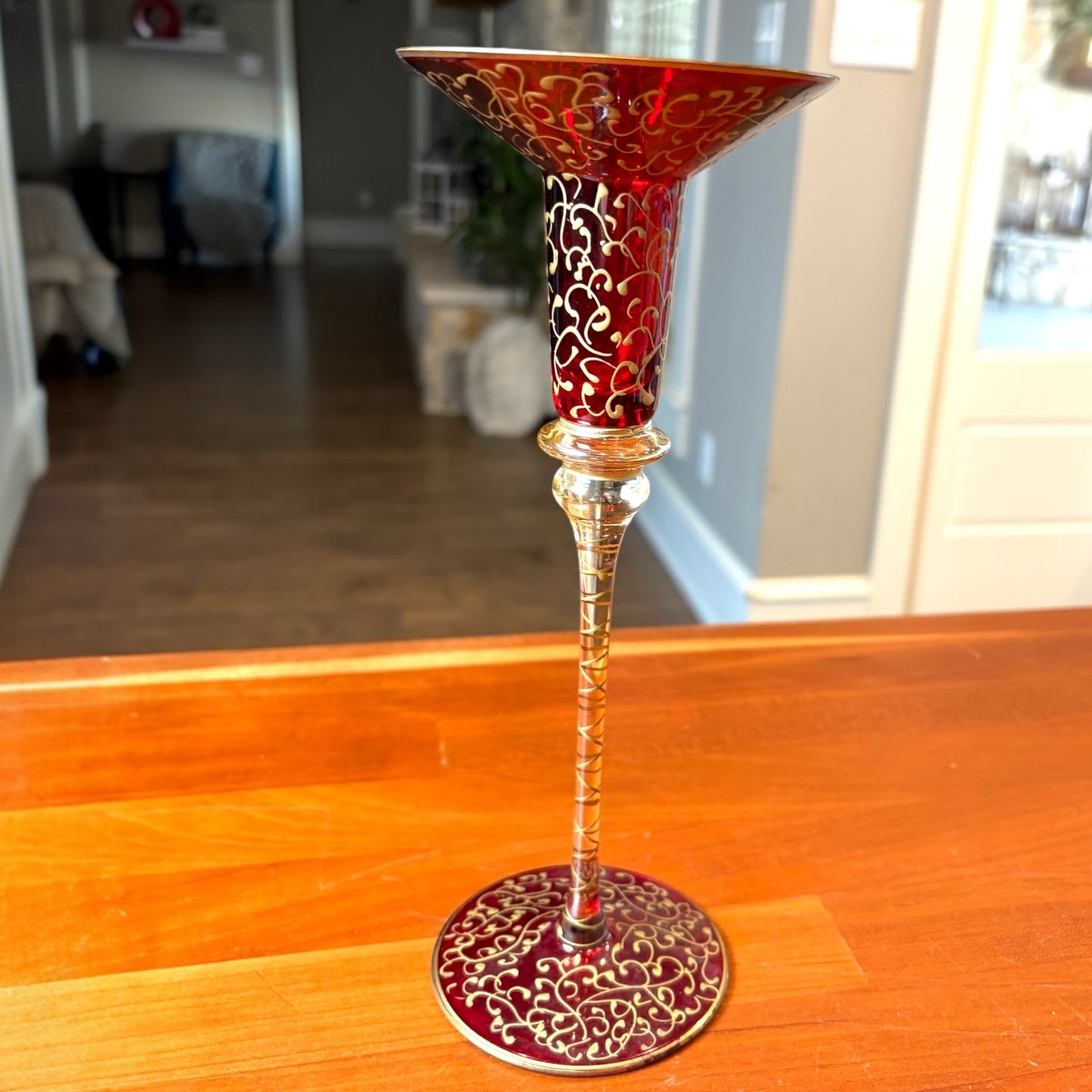 gold swirl design pedestal votive placement